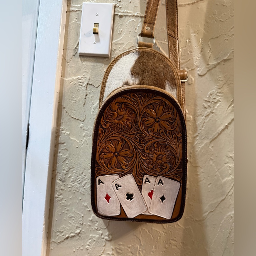 Leather tooled sling bag